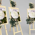 Wooden Art Easels With Framed White Flower Paintings And Decorative Bouquets
