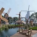 Traditional Wooden Windmills Water Wheel And Pavilion In Scenic Outdoor Setting With Deck