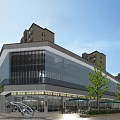 Modern Sales Office Building With Glass Curtain Wall And Tree Surrounded Outdoor Space