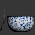 Ceramic Bowl with Blue and White Floral Pattern and Gray Lid on Black Shiny Surface
