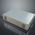 White Rectangular Electronic Device With Ventilation Grilles And Black Cable