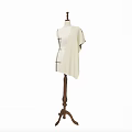 Cream Colored Garment On Wooden Dress Form With Black Tailoring Lines