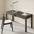 Minimalist Modern Black Desk with Laptop White Cup Green Plant and Chair