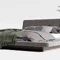 Modern Gray Double Bed With Soft Blanket Headboard And Potted Plant