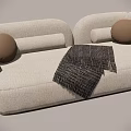 Modern White Multi Person Sofa With Beige Round Pillows And Black Woven Throw