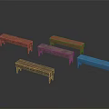 Five Various Colored Wooden Public Long Benches on Black Background