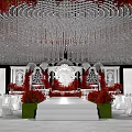 Elegant Wedding Banquet Hall With Crystal Chandelier Red Floral Decorations White Stage And White Chairs