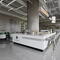 Café Interior Design With White Bar Counter Gray Pillar Green Chairs And Hanging Lights