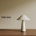 Minimalist White Shade Table Lamp On Wooden Table With Beige Wall Background