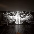 Modern Clubhouse Interior With Arched Structures Dark Wood Floors And Orange Chairs