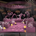 Elegant Pink Banquet Hall With Crystal Chandeliers Floral Decorations And Stage Seating