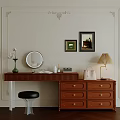 Elegant Wooden Dressing Table With Round Mirror Green Vase Skincare Bottles And Decorative Paintings