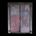 Weathered Entrance Door With Peeling Paint Double Panels And Metal Frame