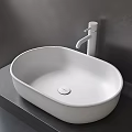 Modern White Oval Vessel Sink with Minimalist Faucet on Gray Countertop