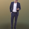 A Man In Navy Blue Business Suit Holding Mobile Phone Standing Against Neutral Background