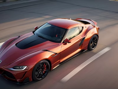 Red Sports Car Driving On Road With Sleek Design And Black Roof 3d model