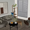 Modern Gray Sofa and Black Coffee Table Set With Decorative Pillows Plants and Fruit Tray