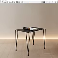 Modern Black Side Table With Slim Legs And Magazine On Light Wall Wooden Floor