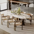 Modern Kitchen Interior With Oval Marble Top Dining Table And Six Beige Upholstered Wooden Chairs