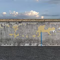Building Exterior Wall With Thatched Roof And Peeling Gray Yellow Patches Against Sky And Water