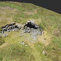 Garden Landscape Featuring Lush Green Grass Scattered Rocks And Natural Terrain