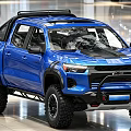 Blue Off Road Pickup Truck With Large Tires Roof Rack And Black Grille
