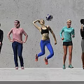 Group of Women with One Jumping to Hit Volleyball and Others Standing