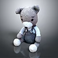 Adorable Gray Knitted Teddy Bear With White Paws And Blue Overalls Design