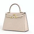 Structured Beige Leather Handbag With Elegant Design And Golden Hardware Details