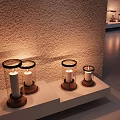 Decorative Ornament Set with Glass Covered Candle Holders Wooden Bases on Light Colored Shelf
