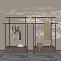 Wooden Clothes Rack With Hanging Clothes Towel And Storage Drawers Against Decorative Patterned Wall