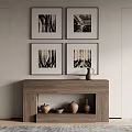 Four Framed Artworks Hanging Above Wooden Console Table With Ceramic Pots And Bowl