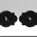 Two Black Ornate Ceiling Medallions With Intricate Patterns And Central Hole