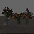 Three Transparent Glass Vases With Colorful Tulips Lavender And Mixed Flowers On Gray Floor
