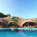 Domed Outdoor Relaxation Buildings With Central Swimming Pool And Green Lawn Area