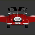 Red Vintage Toy Car With Winged Design Circular Emblem And Spirit License Plate
