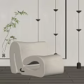 Modern White Curved Bean Bag Chair With Floor Lamps And Bamboo Plant