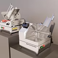 Two Commercial Meat Slicer Machines With Control Panels For Commercial Kitchen Use