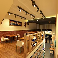 Restaurant Interior With Brick Wall Wooden Counter Stools And Nautical Decor