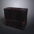 Dark Colored Vintage Leather Suitcase with Worn Surface and Metal Accents for Storage