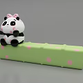 Cute Panda Doll With Pink Bow Sitting On Green Polka Dot Block