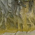 Scenic Coastal Cliff Landscape With Rock Caves Sand Beach And Vegetation