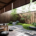 Tranquil Courtyard Garden With Wooden Walls Gravel Path Green Plants And Tea Table