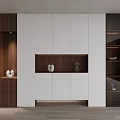 Modern Shoe Cabinet Design With White And Dark Wood Glass Doors And Decorative Sculptures