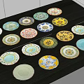 Colorful Patterned Dinnerware Set With Multiple Plates Neatly Arranged On Black Tabletop