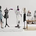 Mannequins in Clothing Display with Clothing Racks Table Books and Rug