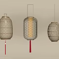 Three Different Design Hanging Lanterns With Woven Frames Red Tassels And Warm Light