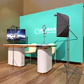 Smart Office Desk With Teal Backdrop Monitor Microphone Ring Light And Chairs
