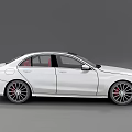 Sleek White Luxury Sedan Featuring Red Interior And Sporty Alloy Wheels