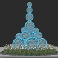 Glowing Blue Spheres Stacked In Pyramid Shape With Grass Base Art Installation